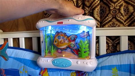 Fisher price crib soother - The Rainforest Waterfall Peek-a-Boo Soother is a crib soother for baby. Music, lights, and motion engage baby. This soother attaches onto the crib rail for a...